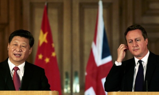 China's President Xi Jinping and Prime Minister David Cameron attend a joint press conference in 10 Downing Street, in central London on the second day of his state visit to the UK Suzanne Plunkett /PA Wire